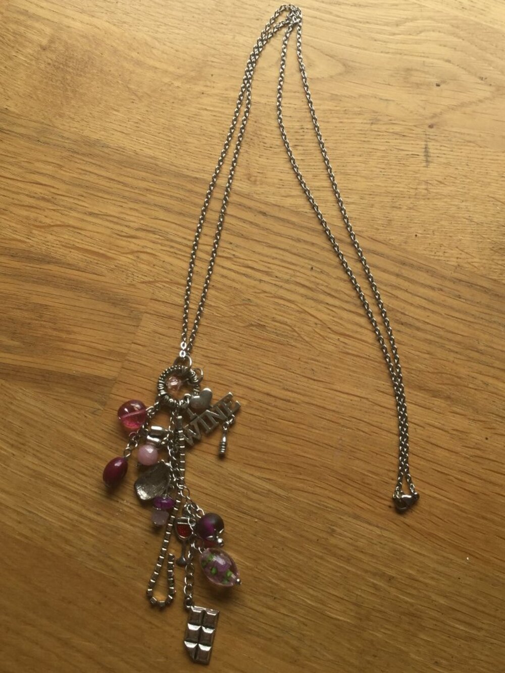 31"necklace with fun charms and matching earrings chain measures 31" pierced